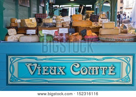 FLORENCE, ITALY - SEPTEMBER 2016 : Different type of cheese sold at Vieux Comte booth at Piazza di Santa Maria Novella, outdoor market in Florence, Italy on September 21, 2016.