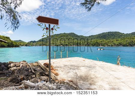 Traditional Port With Blank Signpost, Blue Sky, Blue Water