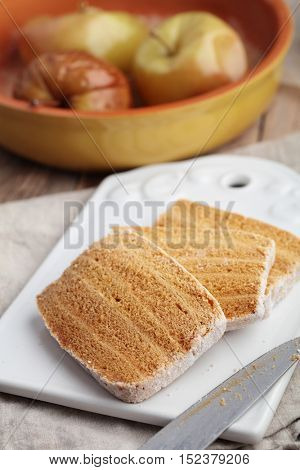 Slices of apple pastila, the traditional Russian sweets, and baked apples