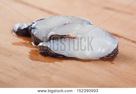 Marine fish on the kitchen board isolated on white background