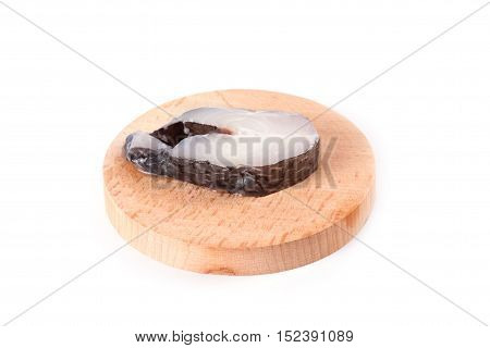 Marine fish on the kitchen board isolated on white background