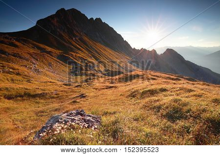 golden autumn sunrise in rocky Alps Austria