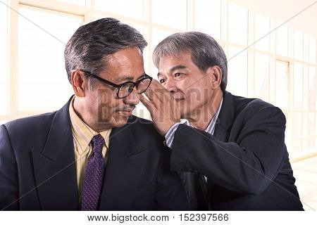 two asian senior business man gossip for business strategy isolated white background