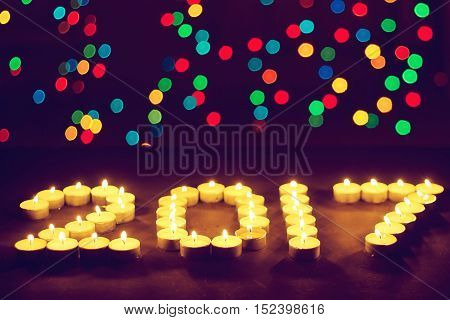 Happy New Year 2016 - festive candles. Selective focus on foreground.