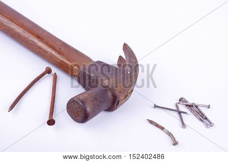 old Traditional curved claw hammer and rust nail tack used on white background tool isolated