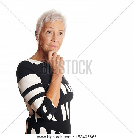 contemplative older woman looking up. with copy space