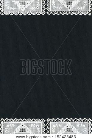 Image of lace borders on black background