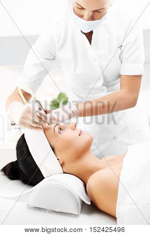 Beautiful neckline, microdermabrasion.
Relaxed woman during a microdermabrasion treatment in beauty salon