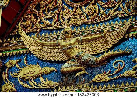 Phuket City Thailand - January 8, 2011: A gilded Thai Phoenix decorates the Ubosot Sanctuary Hall at Wat Mongkhol *