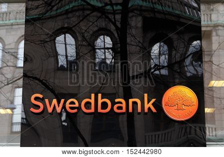 Stockholm, Sweden - April 2, 2015: Reflections at the Swedish bank Swedbank office exterior at Hamngatan.