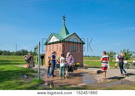 KUREMAE, IDA-VIRUMAA COUNTY, ESTONIA - AUGUST 21, 2016: Pilgrims near The Holy Spring on the place of Marian apparition. Located not far from Puhtitsa Orthodox Dormition Convent