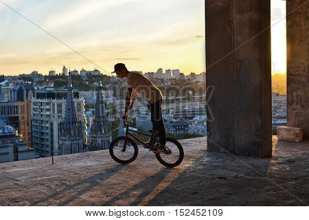 Bmx Freestyle. A Man On Bmx Doing Tricks.