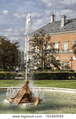 Aranjuez Spain - October 16 2016: Beautiful fountain near the Royal Palace of Aranjuez located in the Royal Site and town of Aranjuez UNESCO World Heritage site Madrid province Spain