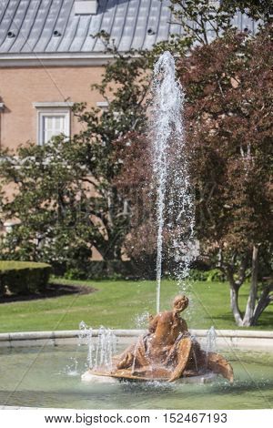 Aranjuez Spain - October 16 2016: Beautiful fountain near the Royal Palace of Aranjuez located in the Royal Site and town of Aranjuez UNESCO World Heritage site Madrid province Spain