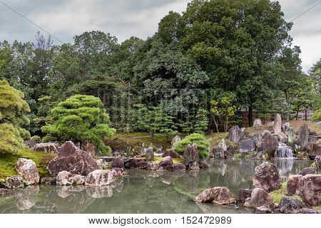 Kyoto Japan - September 19 2016: View on part of the garden of Ninomaru Palace at Nijo Castle. Pond rocks trees.