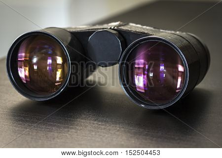 Opera glasses lying on the table close-up.