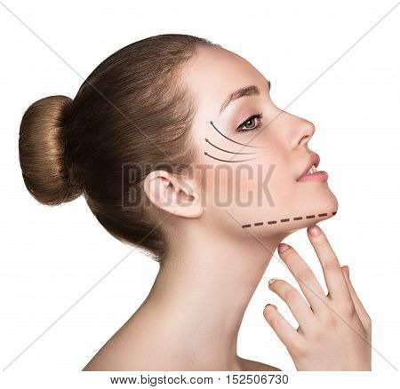 Woman touching her face with lifting arrows isolated on white. Plastic surgery, aging concept.