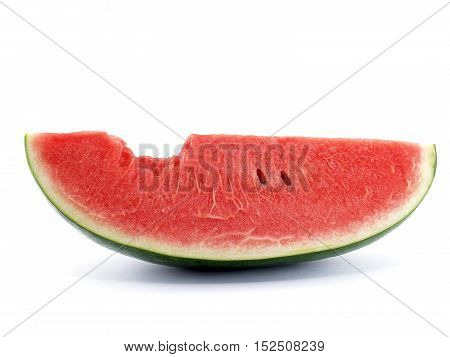 close up slice watermelon with bite mark isolated on white background, tropical fruit are sweet, juicy, rich in fiber and vitamins