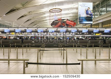 AMSTERDAM, NETHERLANDS - CIRCA NOVEMBER, 2015: check-in counters at Schiphol Airport. Amsterdam Airport Schiphol is the main international airport of the Netherlands.