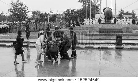 KRABI THAILAND - OCTOBER 19 2016: Thai Krabi official faint during pay respect to the deceased King Bhumibol Adulyadej at Krabi Provincial Hall on October 19 2016 in Krabi Thailand.