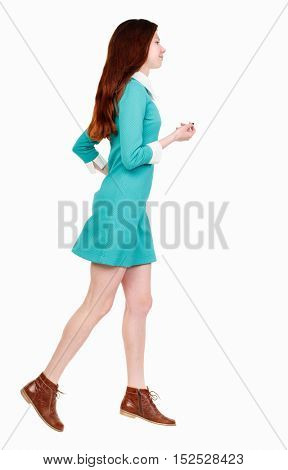 back view of running  woman. beautiful girl in motion. backside view of person.  Rear view people collection. Isolated over white background. A girl in a short blue dress runs away in the side.