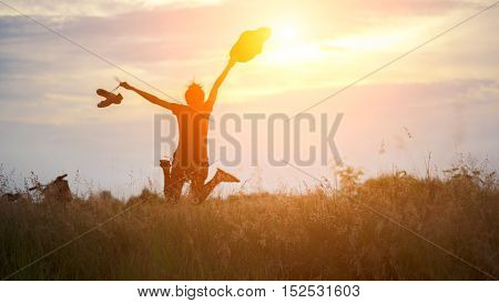 Yong woman in meadow. travel and sunset soft and select focus