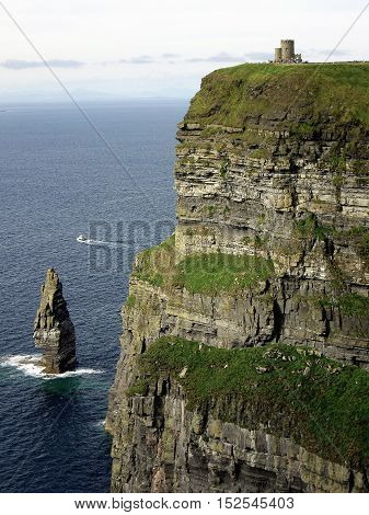 View of Cliffs of moher, Irlanda with castle