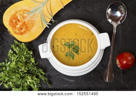 Pumpkin soup with the fresh squash parsley and tomato