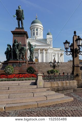 HELSINKI, FINLAND - AUGUST 21, 2016: Statue of Emperor Alexander II on Senate square against Helsinki Cathedral. The statue was built to commemorate his re-establishment of the Diet of Finland in 1863