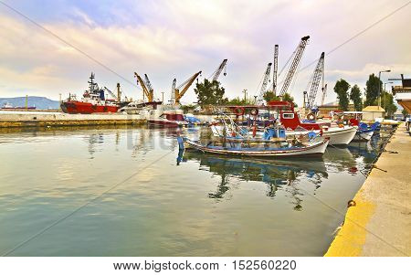 harbor with boats and the industrial area at Eleusis Greece
