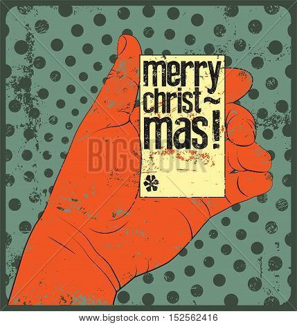 Typographic vintage style Christmas card design. Hand holding Christmas card. Retro grunge vector illustration.