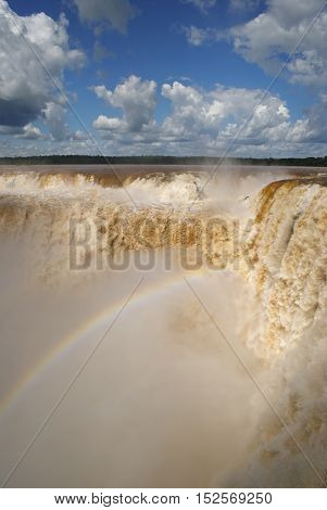 Enormous amounts of water thundering down the devil's throat at Iguazu waterfall, Argentina