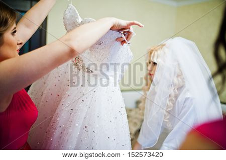 Bridesmaid dress wedding dress on bride at wedding