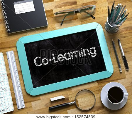 Mint Small Chalkboard with Handwritten Business Concept - Co-Learning - on Office Desk and Other Office Supplies Around. Top View. Co-Learning - Text on Small Chalkboard.3d Rendering.