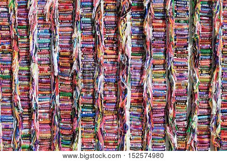 Collection of colorful handmade bracelets with personal names