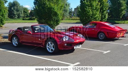 ST NEOTS, CAMBRIDGESHIRE, ENGLAND - SEPTEMBER 11, 2016: Classic Red 1999 Marcos Mantara Sports car.