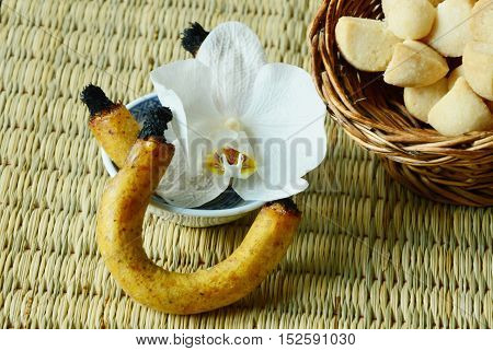 Thai Shortbread Cookies or  Kleeb Lamduan is Thai name.
Thailand dessert and  fragrant or scented candle used for smoking sweetmeats.
