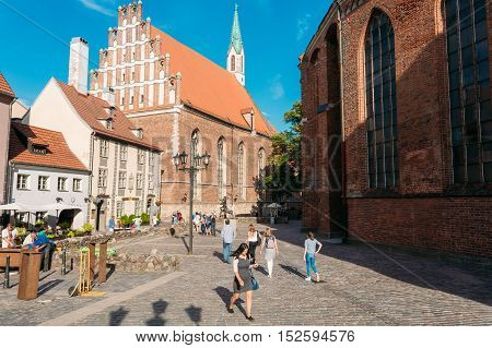 Riga, Latvia - June 30, 2016: View Of St. John's Lutheran Church, The Monument Of Medieval Church Gothic Architecture With Corbie-Steps In Sunny Day.