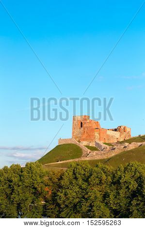 Vilnius, Lithuania. The Remains Of The Ancient Keep Fortress Of Upper Castle On Gediminas Hill, The Part Of The Famous Historical Castle Complex In Sunny Summer Day, Blue Sky Background.