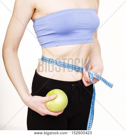 girls stomach measuring with tape isolated on white background, skiny woman on diet, healthcare people concept close up