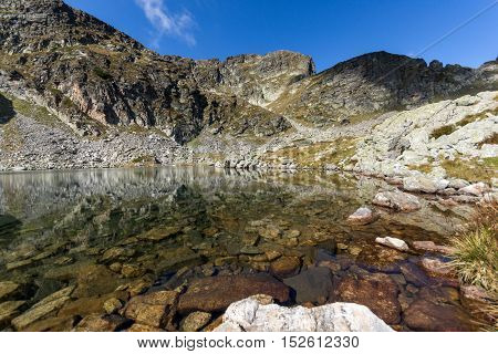 Stones in the water of Elenski lakes and Malyovitsa peak, Rila Mountain, Bulgaria