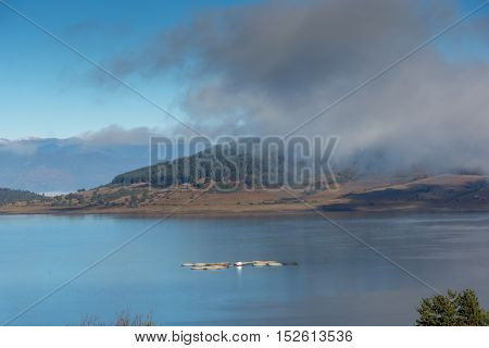 Amazing Autumn panorama with Low clouds over water of Batak Reservoir, Pazardzhik Region, Bulgaria