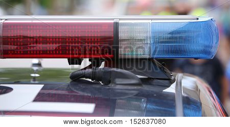 Flashing Lights On The Police Car On Patrol In The City