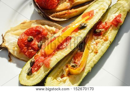 Tasty eggplant aubergine coocked in owen with mix of tomato capers onions and cheese