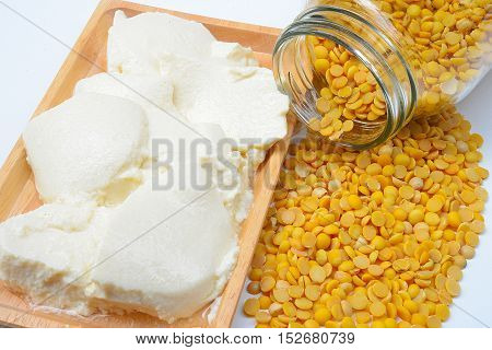 Tofu cubes on plate isolated on white background