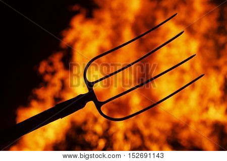 hell fork on the background of fire, Halloween. symbol hell, mysticism