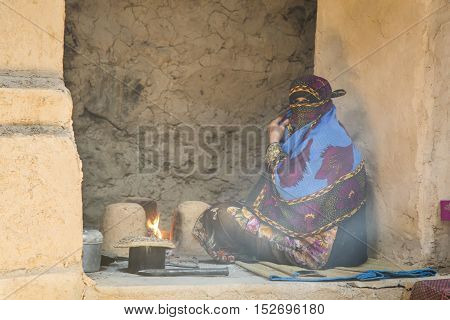 Omani Lady In Traditional Omani Kitchen