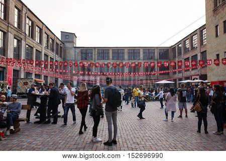 Kiyv Ukraine - October 01 2016: People are relaxing on the street food festival on Darynok market located on an abandoned factory Platforma on the outskirts of Kiyv