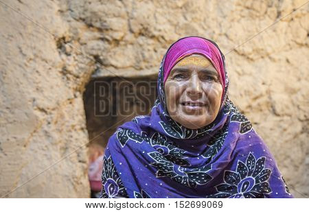Omani Woman Smiling For A Camera