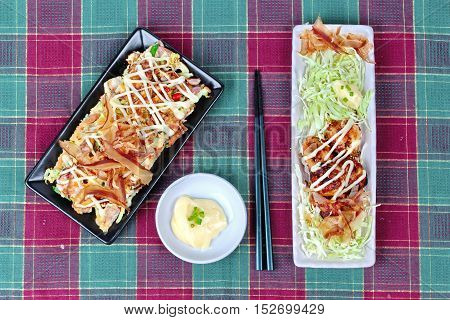 Spicy fried chicken salad (Yum Kai Zap in Thai) served mixed vegetables salad and french fires.